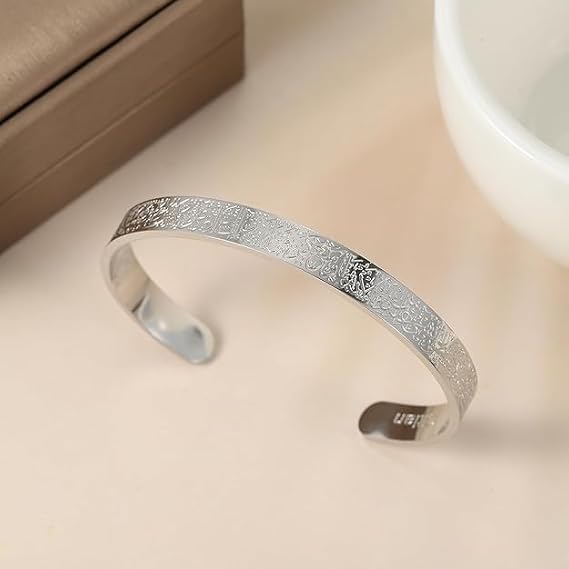 Unisex Ayatul Kursi Islamic open cuff bracelet with Arabic engraving in gold, silver, and black finishes, featuring faith-inspired jewelry design.