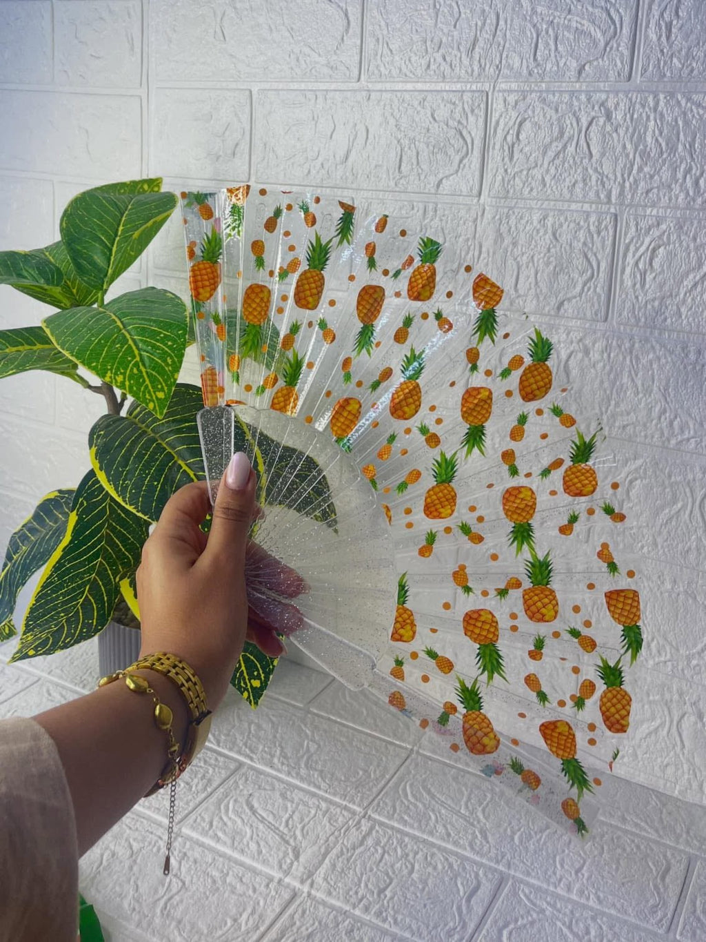 Clear acrylic folding hand fan by 7AGAT, lightweight and portable with a durable transparent frame for weddings and outdoor events.
