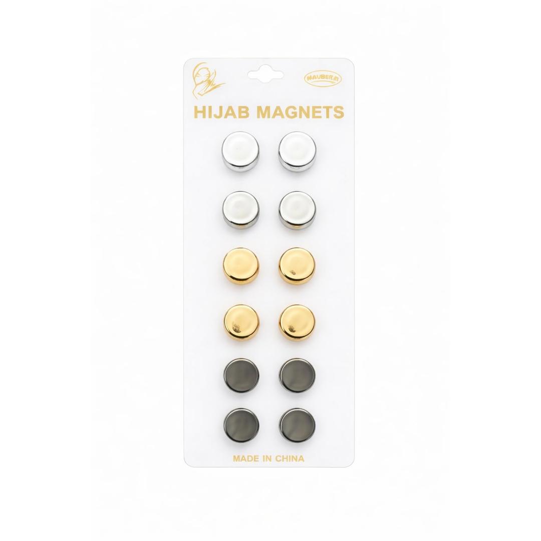 Packaging of hijab magnets with gold, silver, and black colors on a white background.