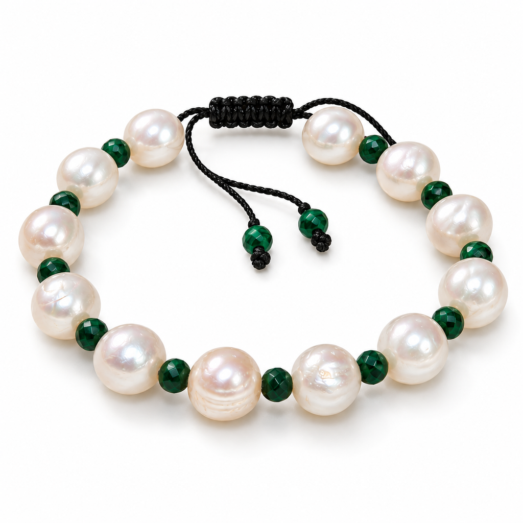 A beaded stretch bracelet featuring large, lustrous white freshwater pearls separated by small, polished dark green beads, finished with a black adjustable cord closure.