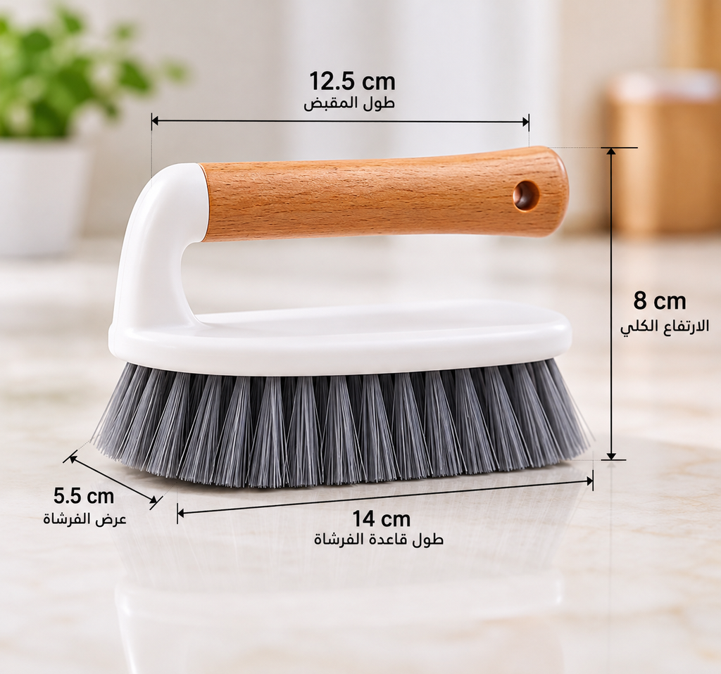 A hand brush with a light brown wooden handle, white plastic body, and gray bristles, shown with overlaid dimension lines and Arabic text indicating measurements: 12.5 cm handle length, 8 cm head height, 5.
