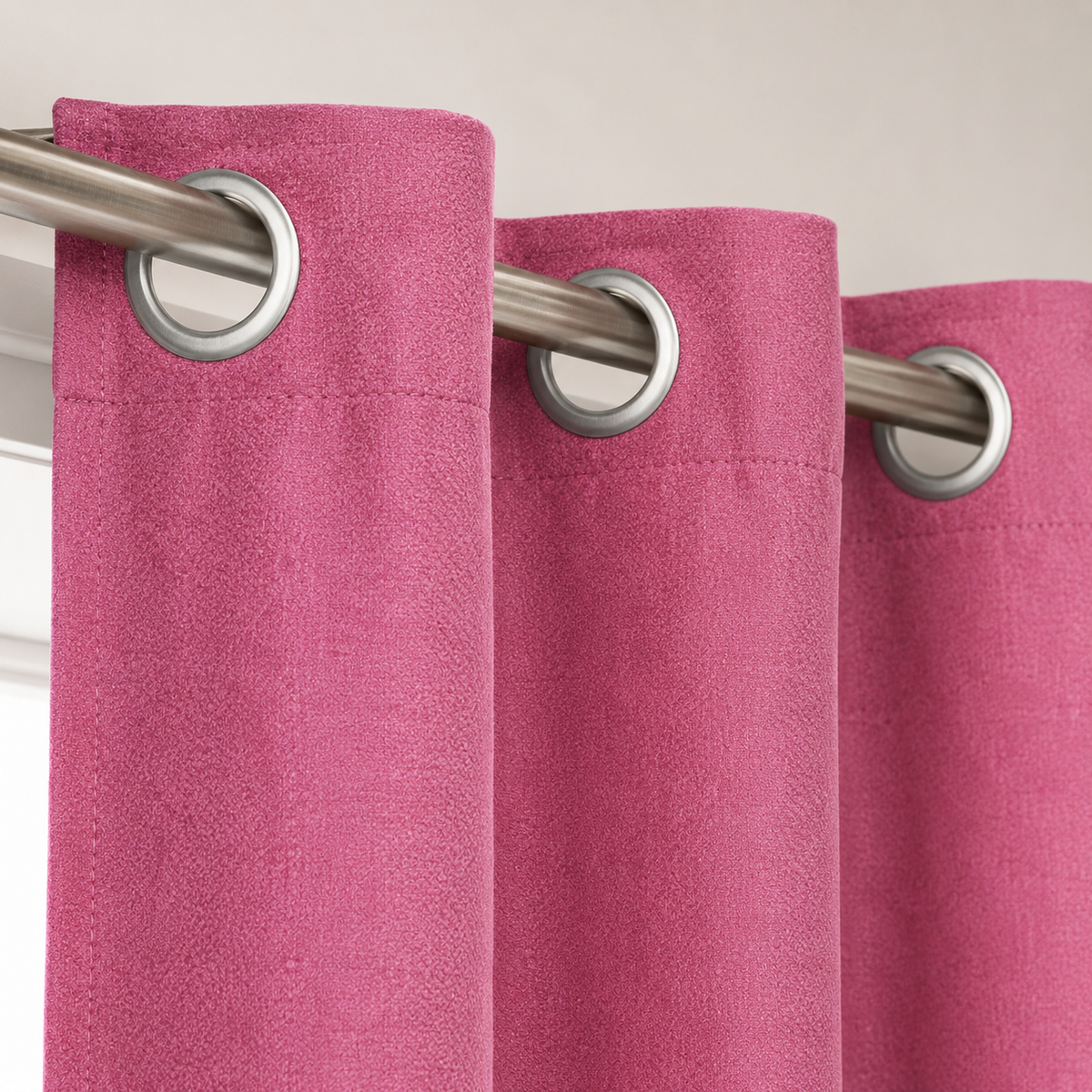 Close-up of a pink window curtain with metal grommet top, 140x140 cm, from 7AGAT, suitable for bedroom and living room.