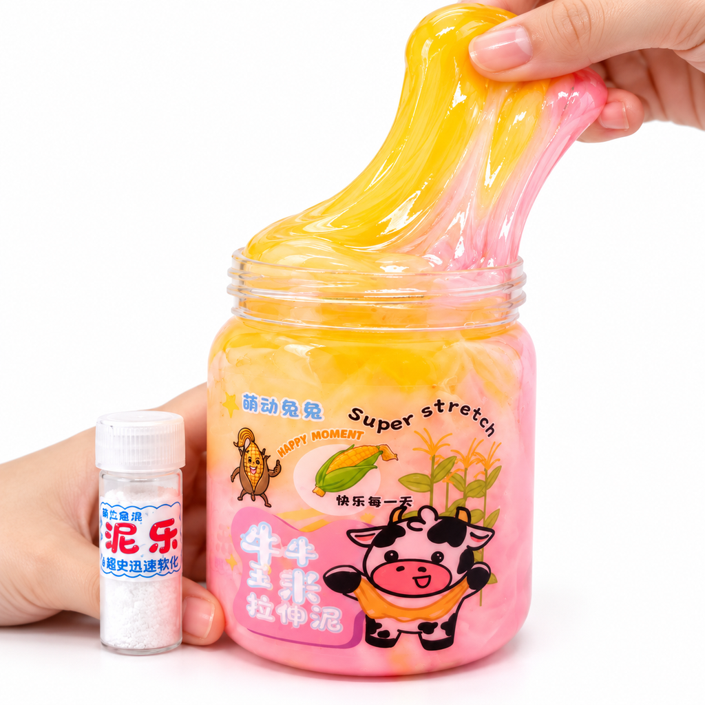 A hand stretches a translucent yellow and pink slime inside a clear jar with cartoon graphics, while another hand holds a small bottle of white powder next to it on a white background.