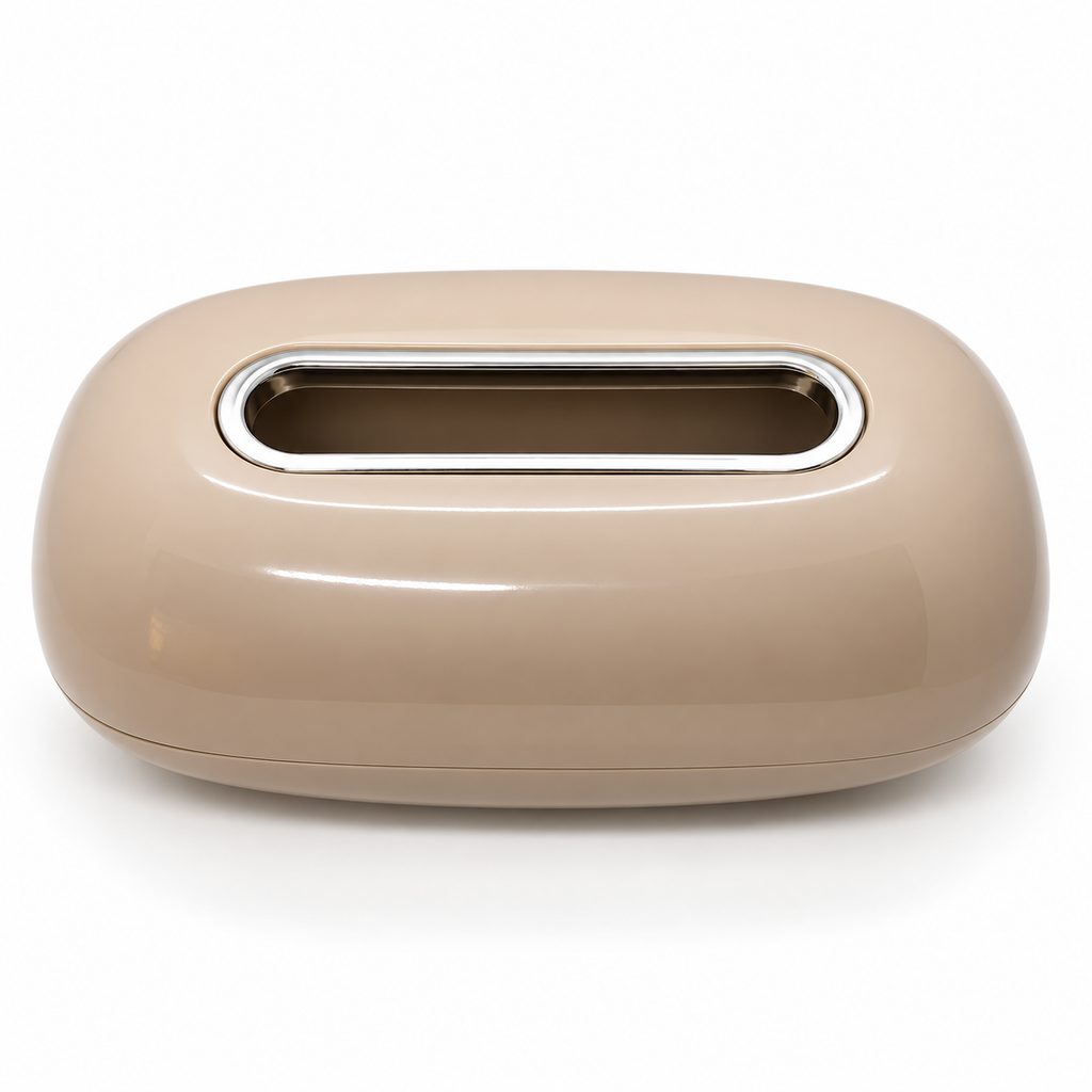 A glossy, rounded rectangular tissue box cover in a warm beige color, featuring a horizontal slot cutout with a polished silver metallic rim, set against a plain white background.