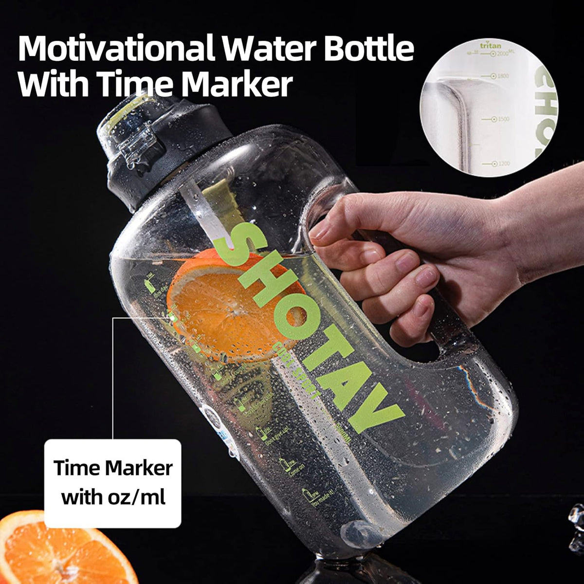 A clear plastic water bottle with a black cap and handle, shown being held by a hand against a black background. The bottle has green 'SHOTAV' branding and a large orange slice graphic inside.