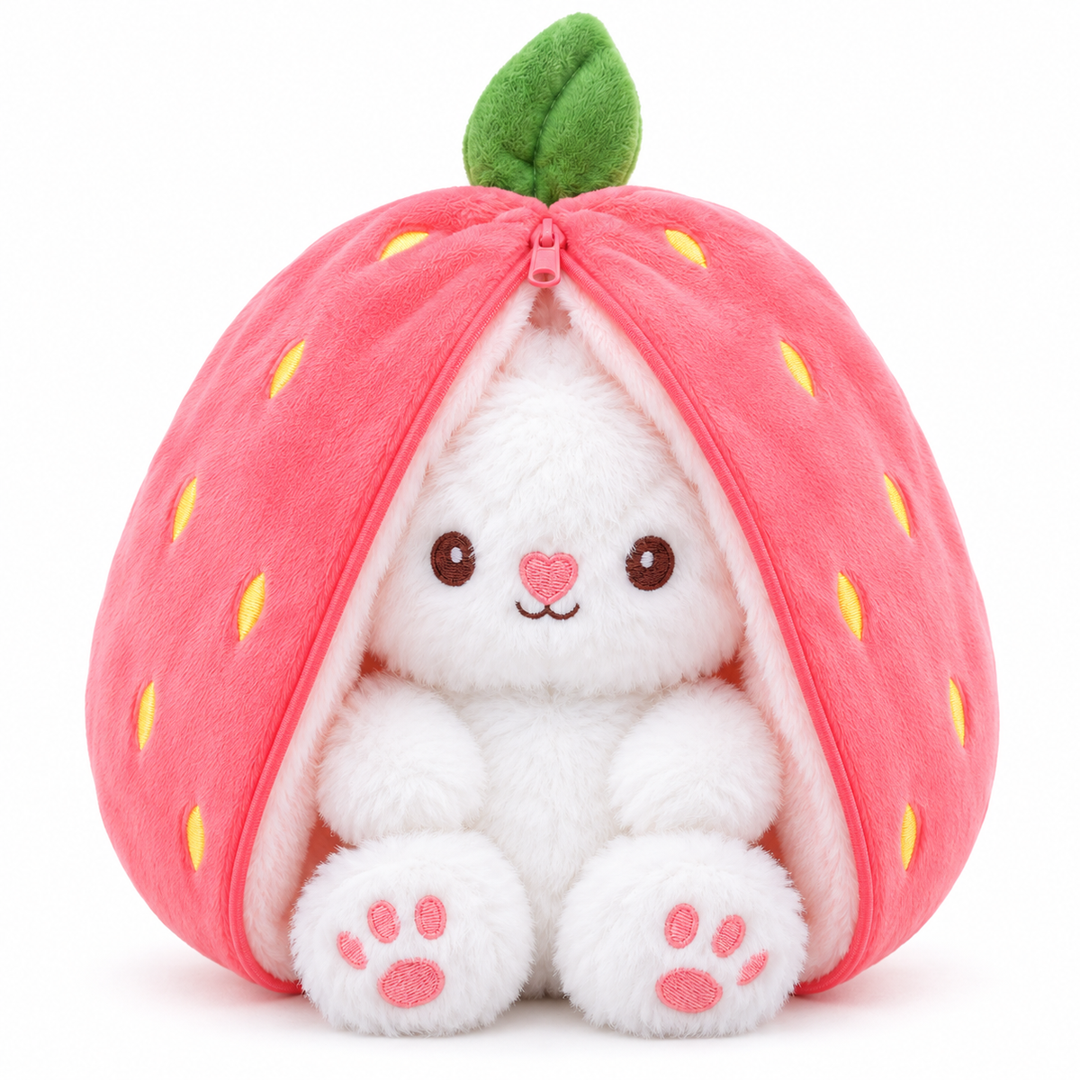 A white plush bunny toy sitting inside a strawberry-shaped pink pouch with a green leaf on top, photographed on a clean white background.