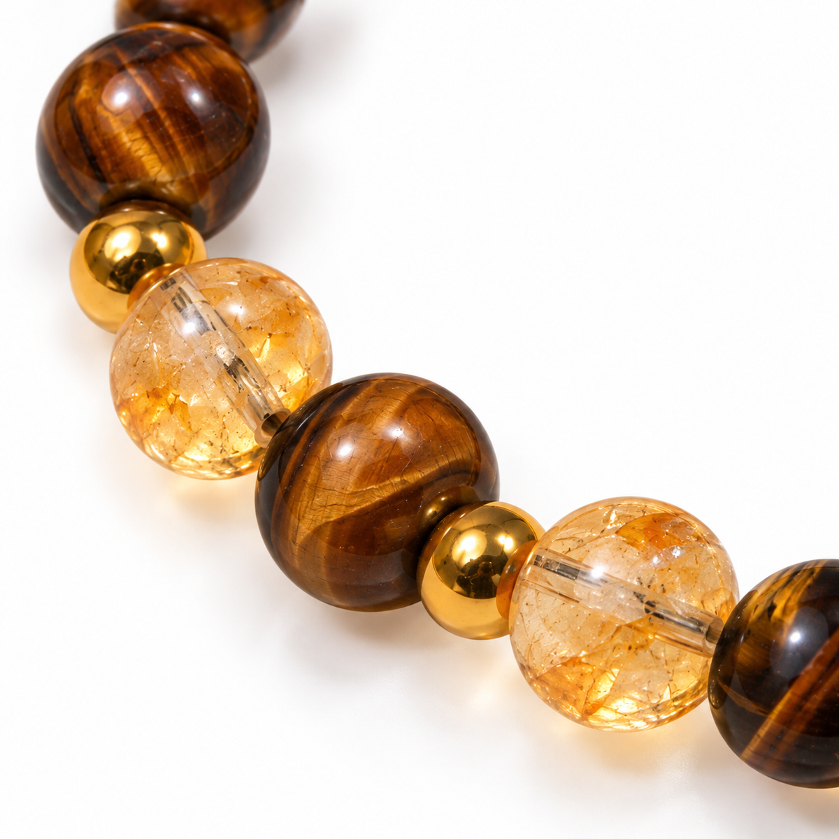 7agat close-up of brown striped Tiger Eye beads, honey Citrine and gold-tone hematite spacer details