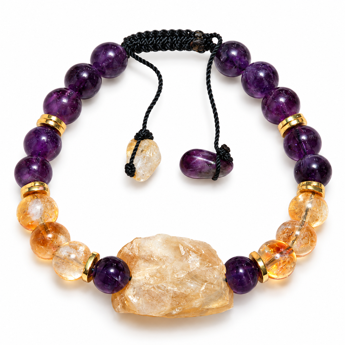 7agat amethyst and citrine beaded bracelet with raw citrine centerpiece and gold-tone hematite spacers on white background.