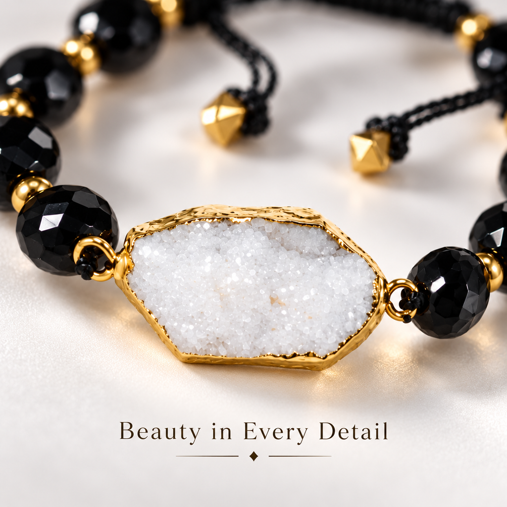7agat close-up of white crystalline Quartz Agate centerpiece with gold-tone edging and black Onyx beads.