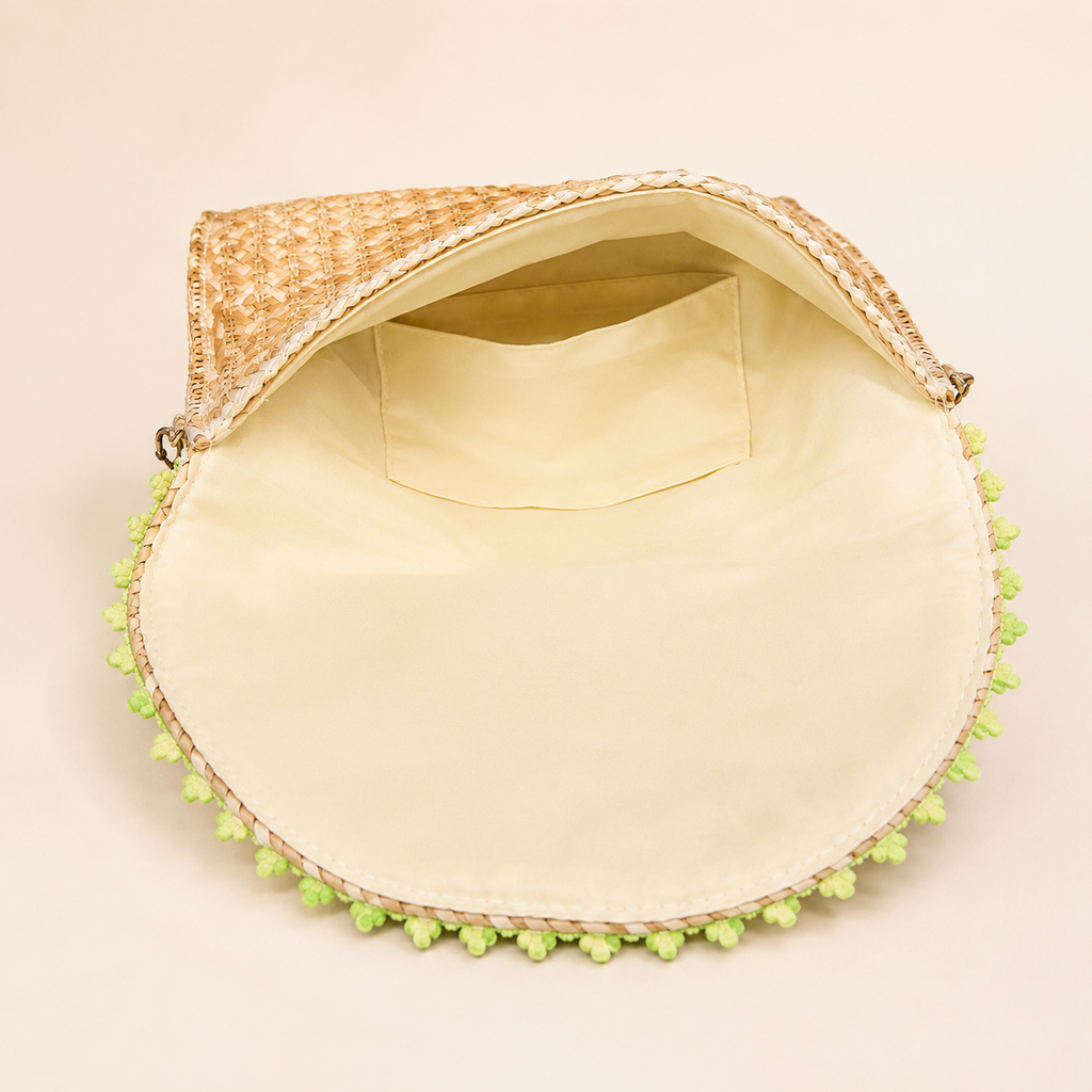 Women’s handmade woven straw clutch bag by 7AGAT with gold chain straps, shoulder and hand carry options, stylish and lightweight.