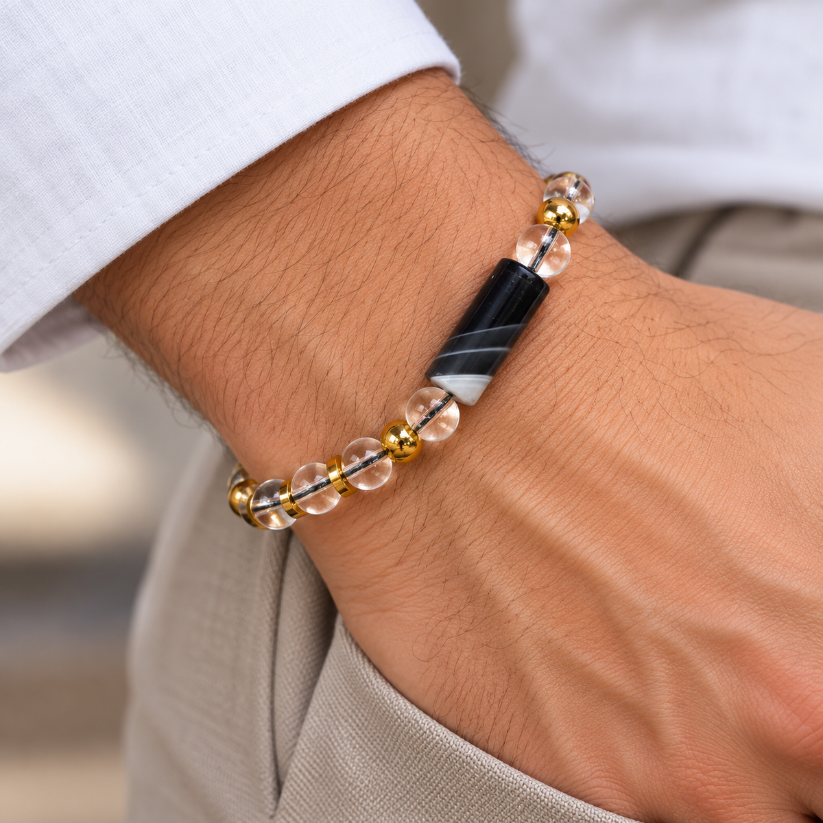 7agat Clear Water Glass and Mixed-Color Cylindrical Agate bracelet worn on a man's wrist.