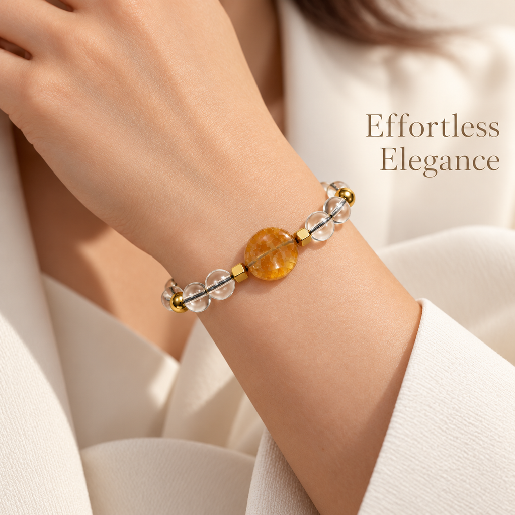 7agat Clear Water Glass bracelet with dark yellow round Agate worn on a woman's wrist.