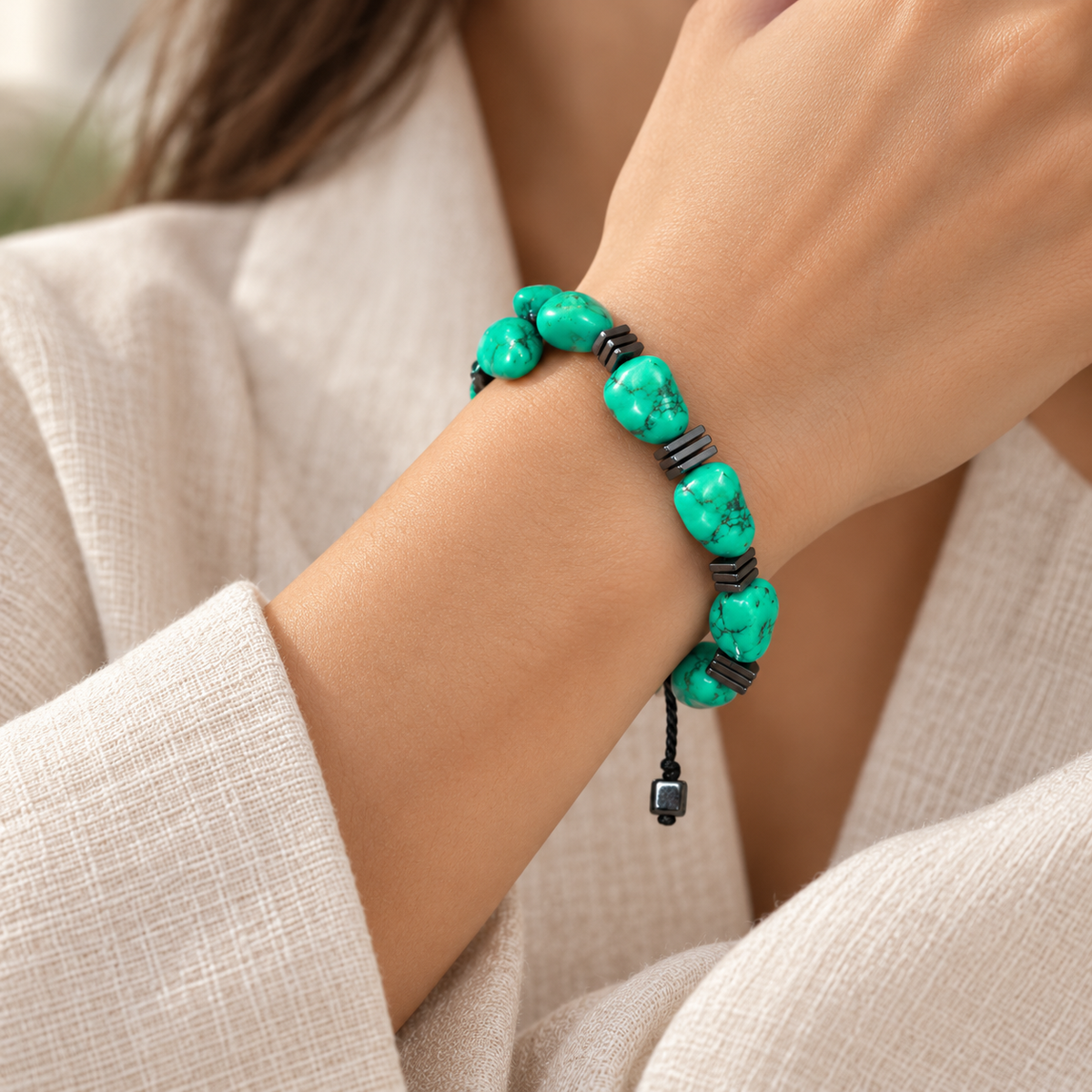 7agat Clear Water Glass bracelet with round Light Blue Agate worn on a woman's wrist.