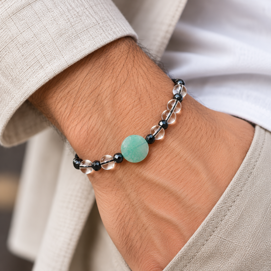 7agat Clear Water Glass bracelet with round Light Green Agate worn on a man's wrist.