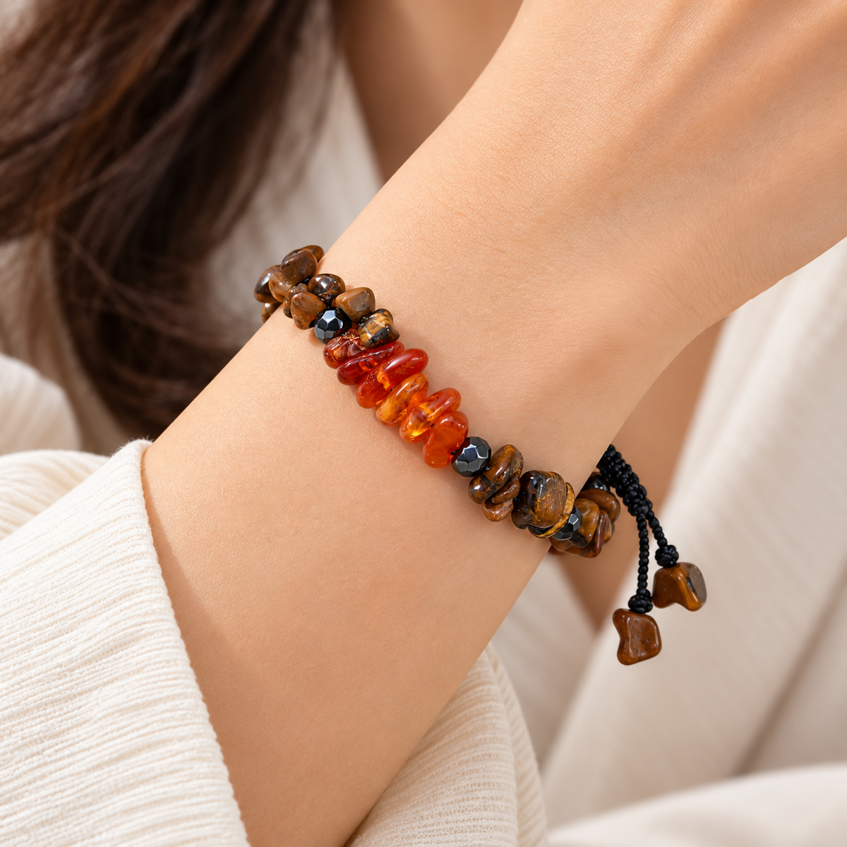 7agat Brown Tiger Eye and Natural Amber chip bracelet styled on a woman's wrist with neutral clothing