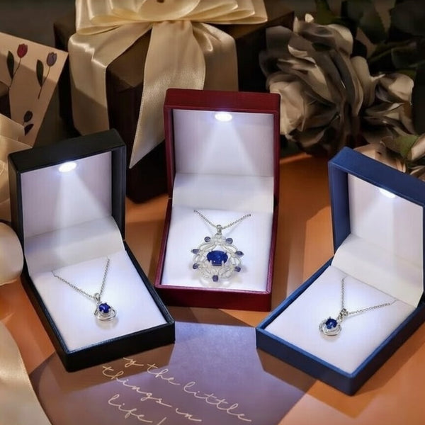 Luxury octagonal LED jewelry box by 7AGAT with compartments for necklaces and earrings, ideal for proposals and anniversaries.