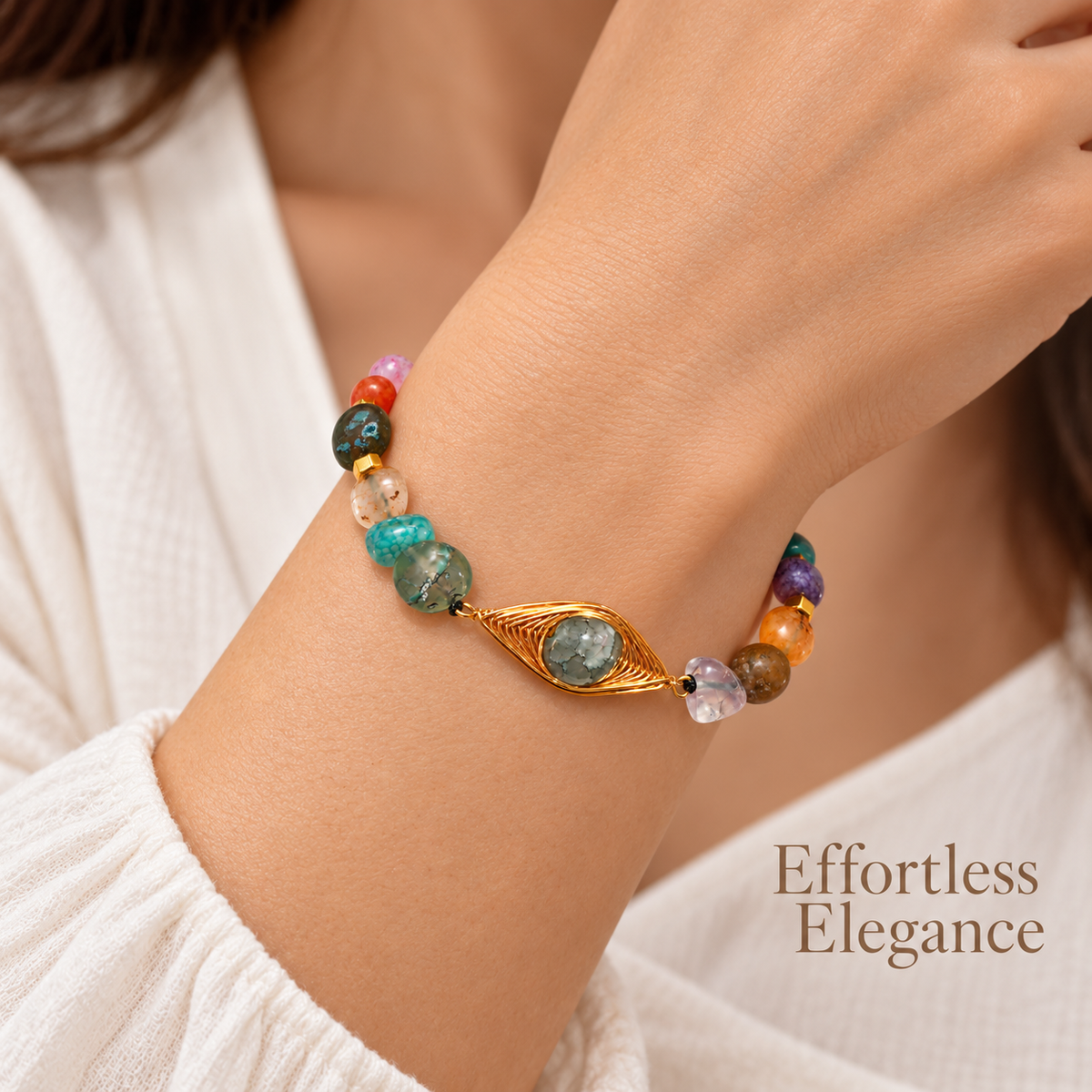 7agat mixed color Agate and Gold Hematite bracelet with copper centerpiece worn on a woman's wrist.