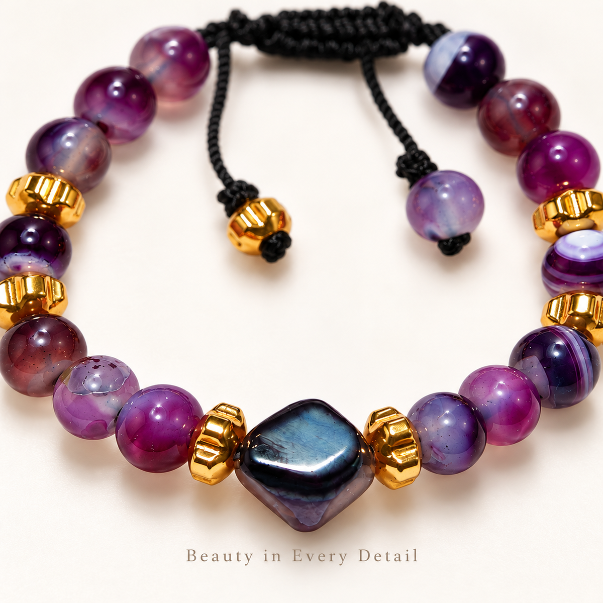 7agat close-up of polished Purple Agate beads Hexagonal Agate centerpiece and Gold Hematite details.