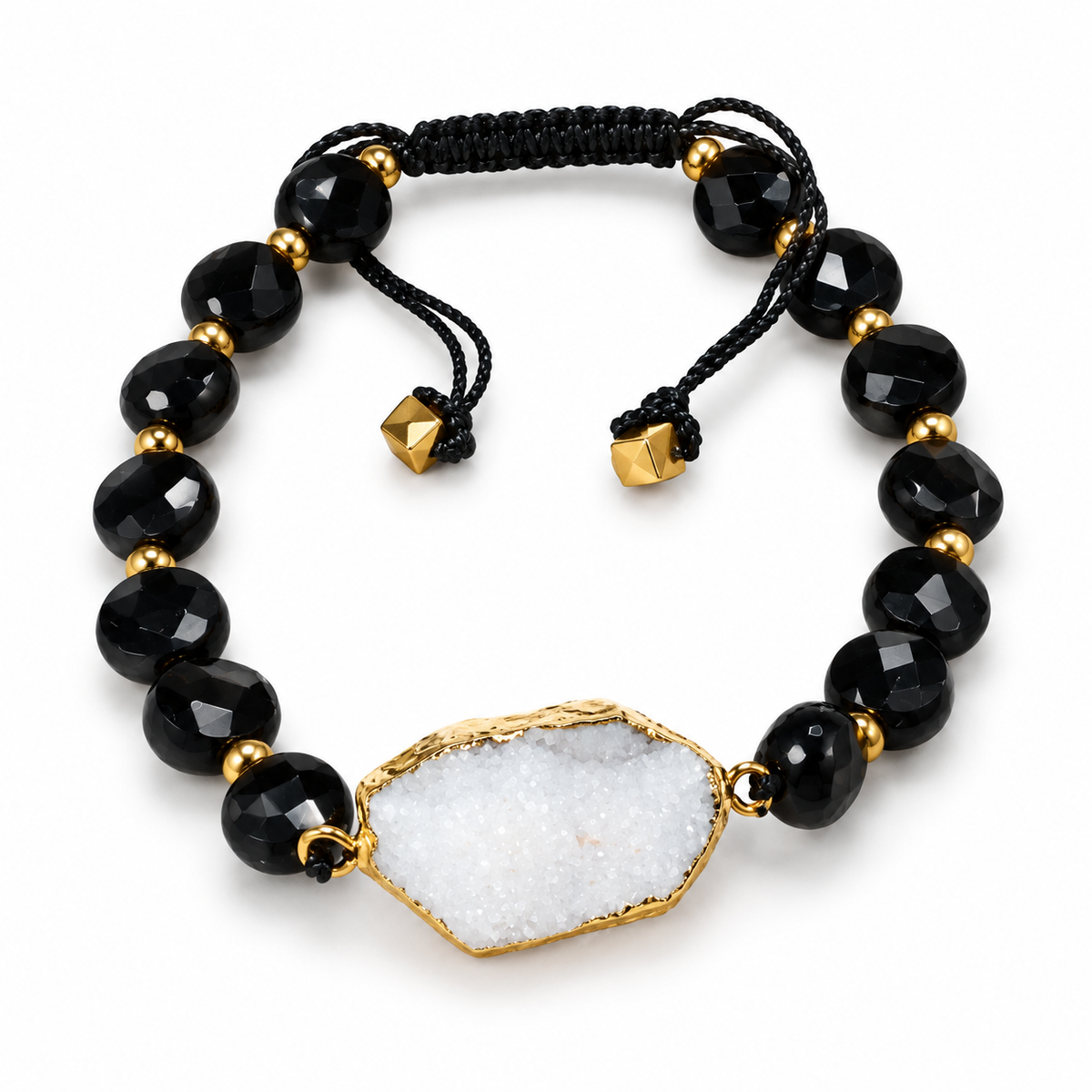7agat faceted black Onyx bracelet with White Quartz Agate centerpiece and gold Hematite spacers on white.
