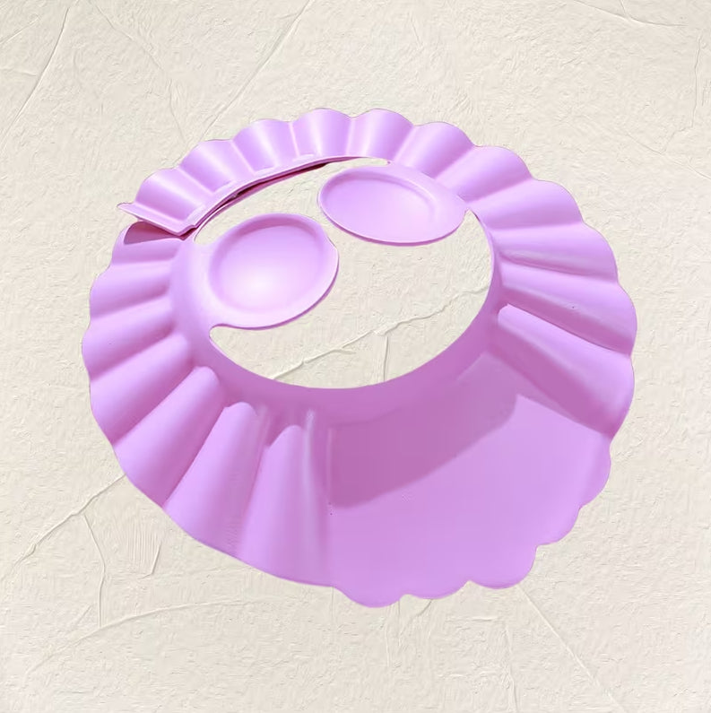 Adjustable kids' shower cap with ear protection and water-resistant EVA material, designed for baby hair washing by 7AGAT.
