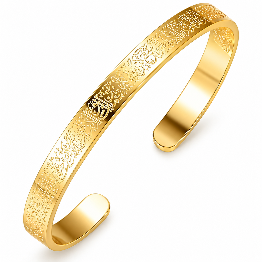 A polished gold-tone open cuff bangle bracelet featuring detailed Arabic calligraphy engraving on the outer band, shown on a clean white background.
