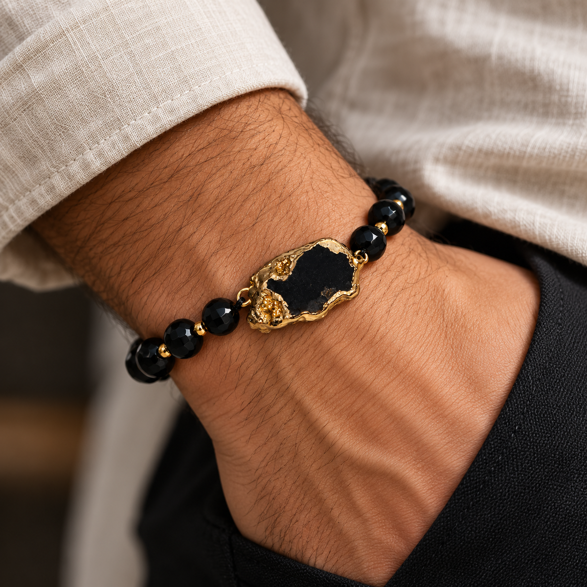 7agat faceted onyx bracelet worn on male wrist.